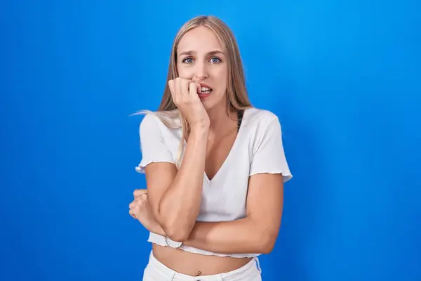 Young Caucasian Woman Standing Blue Background Looking Stressed Nervous Hands — Stok fotoğraf
