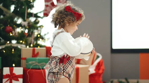 Adorable Hispanic Girl Playing Tambourine Standing Christmas Tree Home — Stock Photo, Image