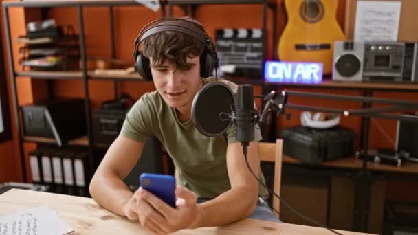 Young Hispanic Teenager Charismatic Radio Reporter Masterfully Reading News Information — Stock Video