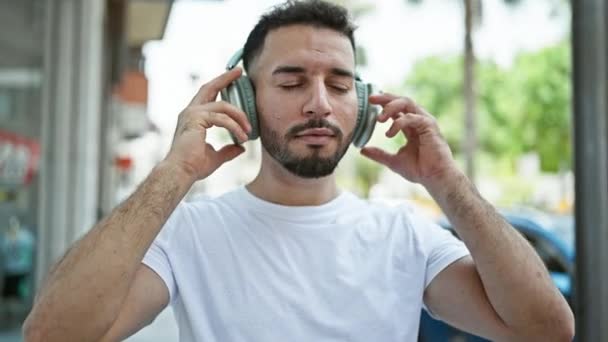 Young Arab Man Listening Music Dancing Street — Stockvideo