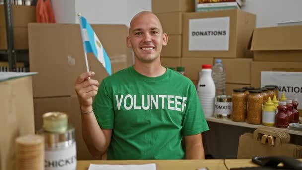 Young Hispanic Man Volunteer Smiling Confident Holding Flag Argentina Charity — Stock Video