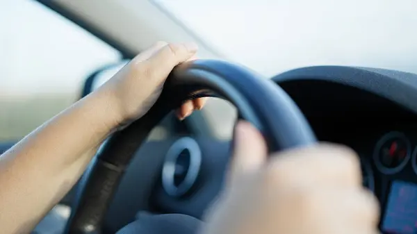 stock image Young beautiful hispanic woman driving a car on the road