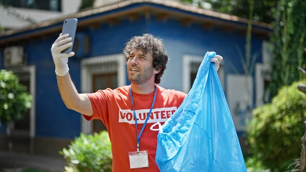Young Hispanic Man Activist Holding Garbage Bag Having Video Call — Stock Photo, Image