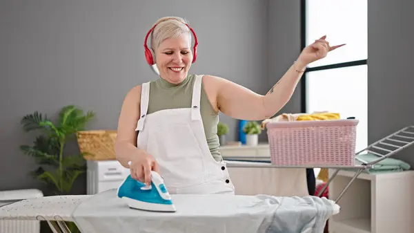 Middle Age Grey Haired Woman Listening Music Ironing Clothes Laundry — Stock Photo, Image