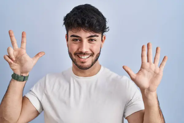 Hispanic Man Beard Standing White Background Showing Pointing Fingers Number — Stock Photo, Image