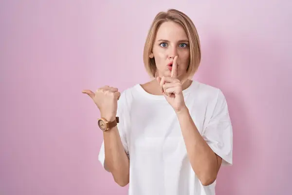 Young Caucasian Woman Standing Pink Background Asking Quiet Finger Lips — Stock Photo, Image