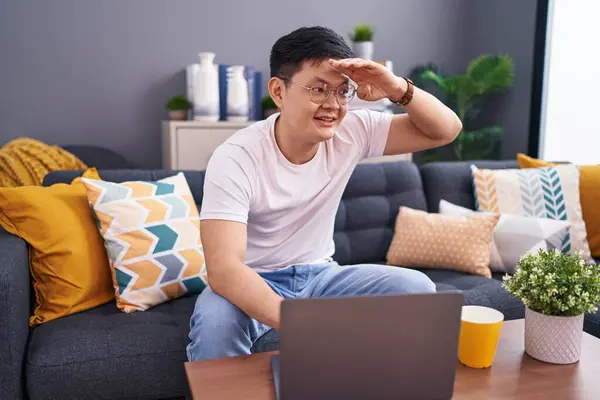Young Asian Man Using Laptop Home Sitting Sofa Very Happy — Stock Photo, Image