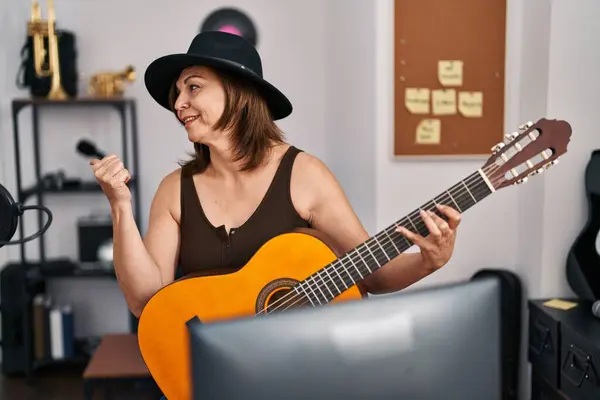 Middle Age Hispanic Woman Playing Classic Guitar Music Studio Pointing — Stock Photo, Image