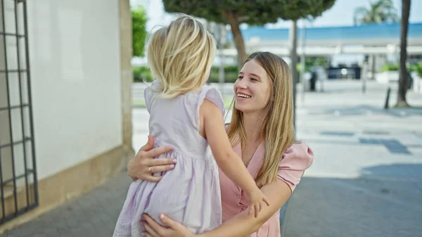Cheerful Caucasian Mother Daughter Embracing Warm Loving Hug Sitting City — Stock Photo, Image