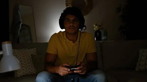 Young Latin Man Playing Video Game Sitting Sofa Home —  Fotos de Stock