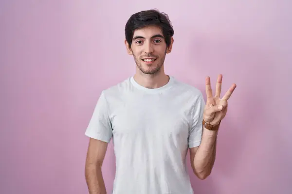 Young Hispanic Man Standing Pink Background Showing Pointing Fingers Number — Stok fotoğraf