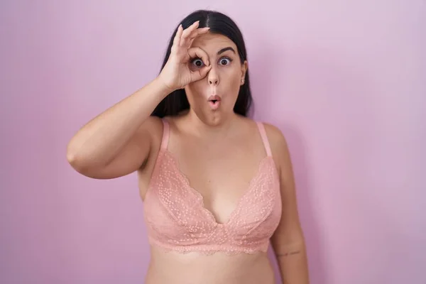Young Hispanic Woman Wearing Pink Bra Doing Gesture Shocked Surprised — Stock Photo, Image