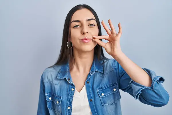 Hispanic Woman Standing Blue Background Mouth Lips Shut Zip Fingers — Stock Photo, Image