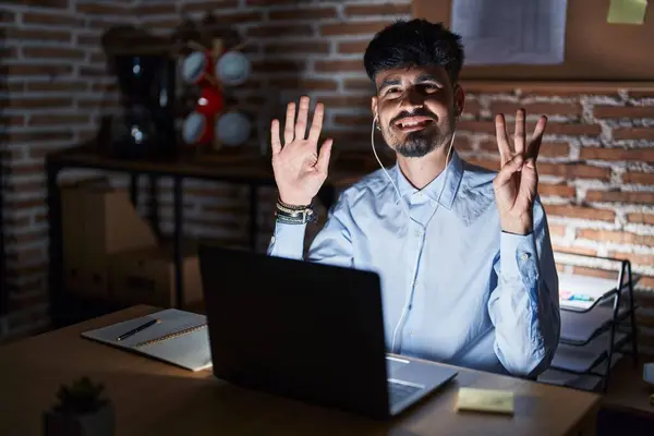 Young Hispanic Man Beard Working Office Night Showing Pointing Fingers — Stock Photo, Image