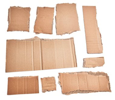  Ripped pieces of cardboard material over isolated white background