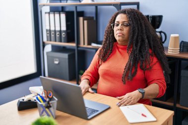 African american woman business worker doing yoga exercise at office