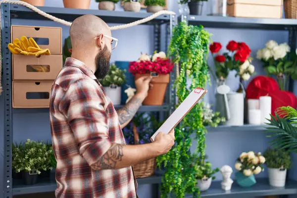 Young Bald Man Florist Reading Document Holding Plant Flower Shop — Photo