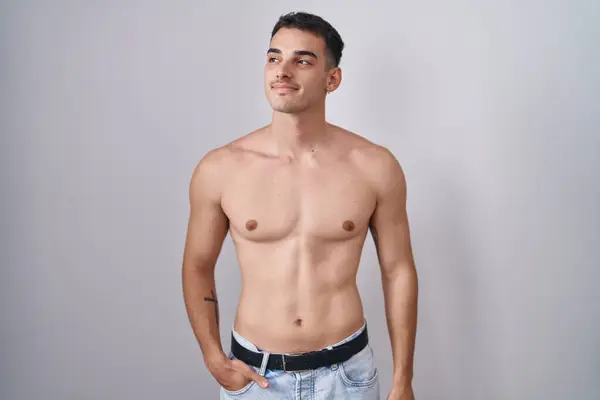 Handsome Hispanic Man Standing Shirtless Smiling Looking Side Staring Away — Stockfoto