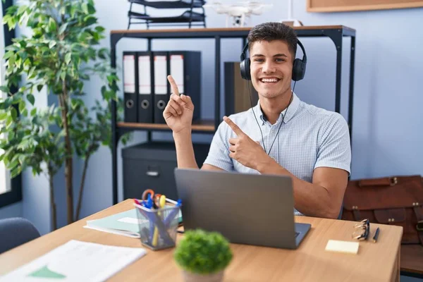Young Hispanic Man Working Office Wearing Headphones Smiling Looking Camera — Stock Photo, Image