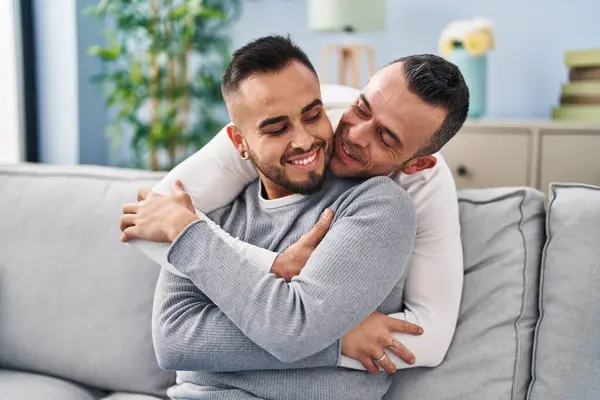 Two Men Couple Hugging Each Other Sitting Sofa Home —  Fotos de Stock