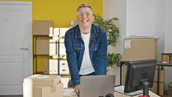 stock image Young caucasian man ecommerce business worker smiling confident using laptop at office