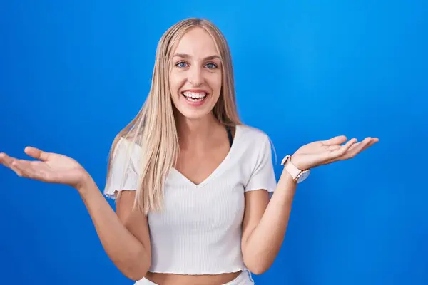 Young Caucasian Woman Standing Blue Background Smiling Cheerful Open Arms — Fotografia de Stock
