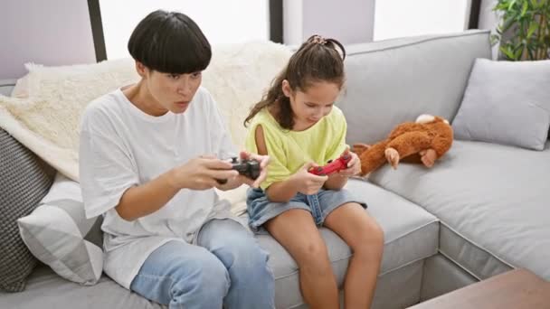 Comfort Home Mother Daughter Joyfully Celebrating While Gaming Sofa — Stock Video