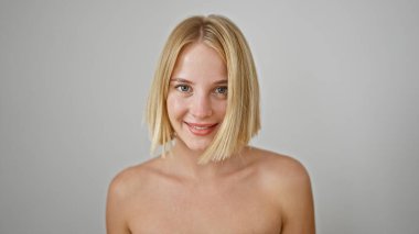 Young blonde woman smiling confident standing over isolated white background