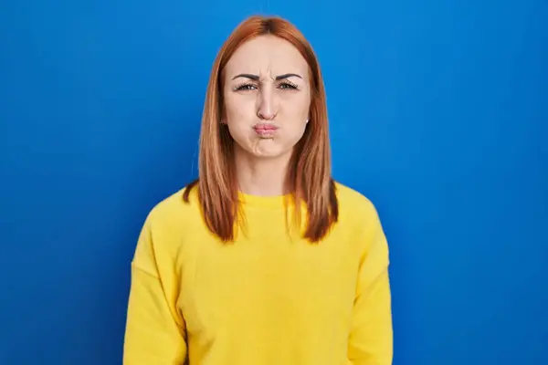 Young Woman Standing Blue Background Puffing Cheeks Funny Face Mouth —  Fotos de Stock