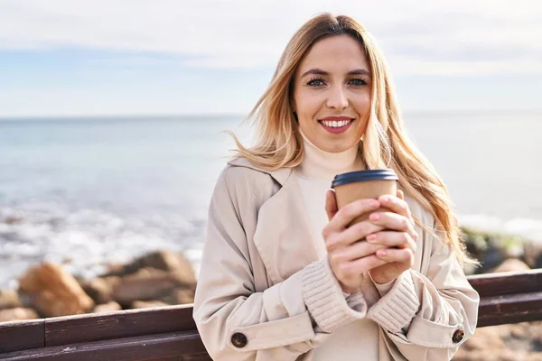 Young Blonde Woman Smiling Confident Drinking Coffee Seaside — Stock Photo, Image