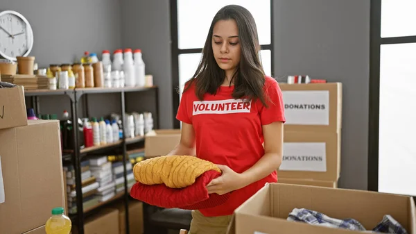 Selfless Young Hispanic Woman Volunteering Charity Center Diligently Packaging Donated — Stock Photo, Image