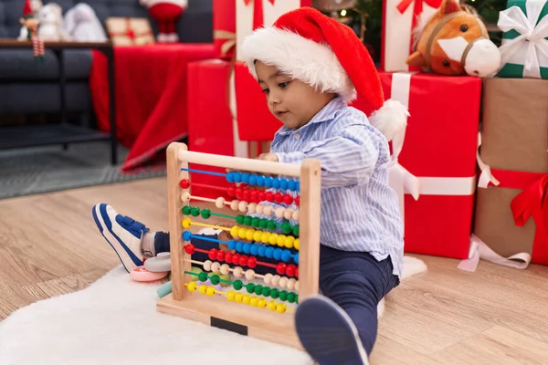 Adorable Hispanic Toddler Playing Abacus Sitting Floor Christmas Gifts Home — Stock Photo, Image