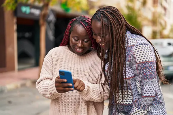 African American Women Friends Smiling Confident Using Smartphone Street — Stock Photo, Image