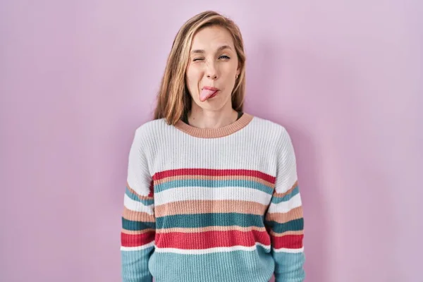Young Blonde Woman Standing Pink Background Sticking Tongue Out Happy — Stock fotografie
