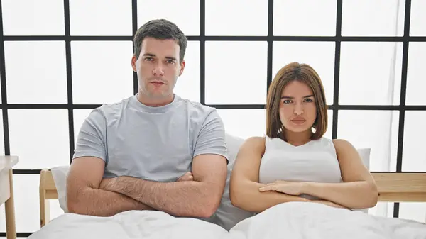 Beautiful Couple Sitting Bed Arms Crossed Gesture Looking Upset Bedroom — Stock Photo, Image