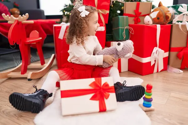 Adorable Blonde Girl Unpacking Teddy Bear Gift Sitting Floor Christmas — Stock Photo, Image