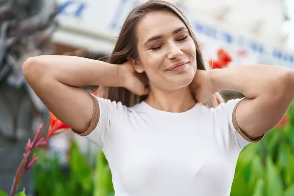 Young Caucasian Woman Smiling Confident Relaxed Hands Head Park — Stockfoto