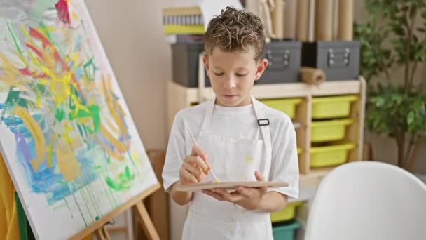 Adorable Blond Boy Artist Confidently Holding Paintbrush Palette Smiling Art — Stock Video