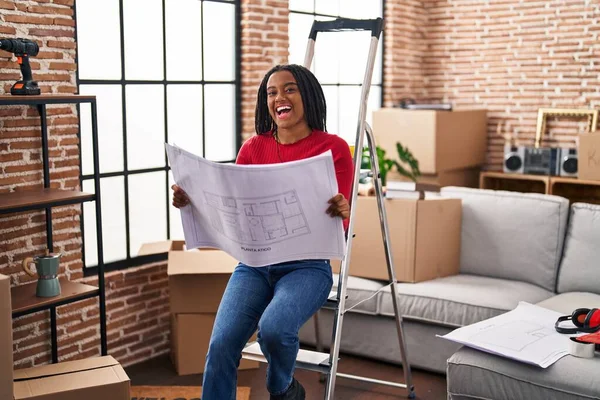 Young African American Braids Standing New Home Looking Blueprints Smiling — Stock Photo, Image