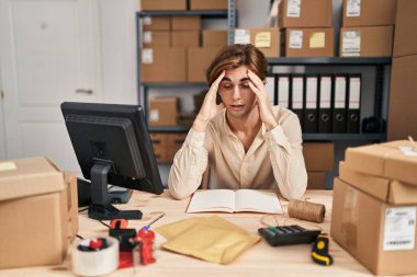 Young caucasian man ecommerce business worker stressed at office