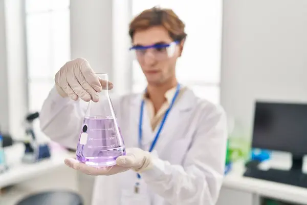 Young Caucasian Man Scientist Looking Test Tube Laboratory — Foto Stock