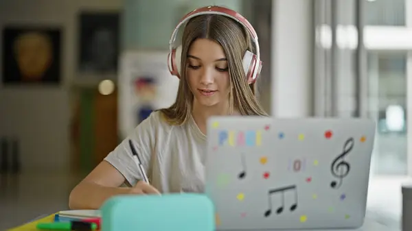Young Beautiful Girl Student Using Smartphone Headphones Taking Notes Library — Stock Photo, Image