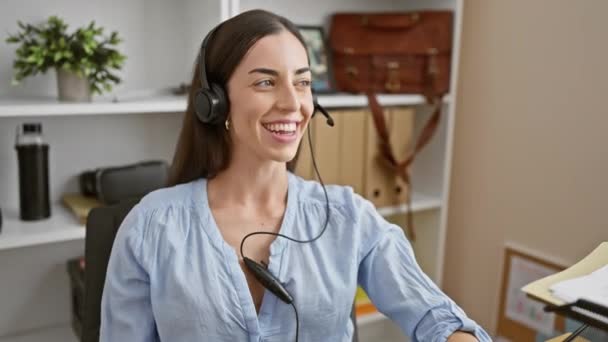Confident Young Hispanic Woman Wearing Headset Office Smiles Naturally While — Stock Video