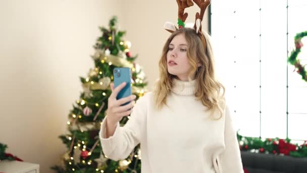 Young Blonde Woman Making Selfie Smartphone Standing Christmas Tree Home — Stock Video