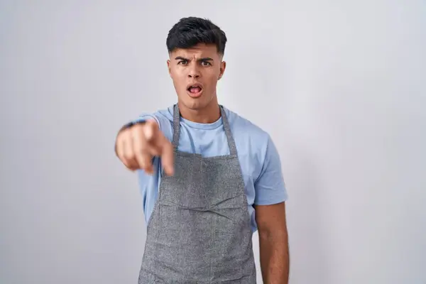 Hispanic Young Man Wearing Apron White Background Pointing Displeased Frustrated — Fotografia de Stock