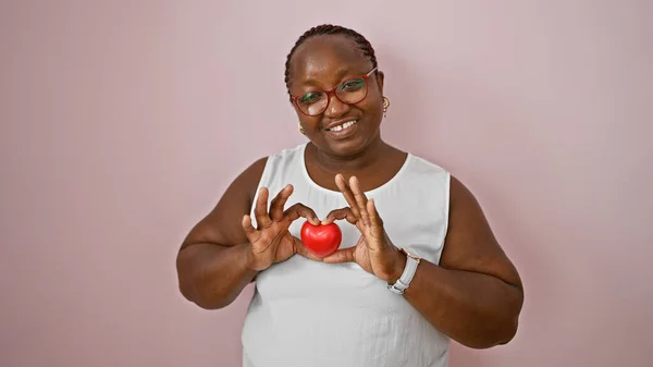 Confident African American Woman Joyfully Holds Heart Shape Hands Smiling — Stock Photo, Image