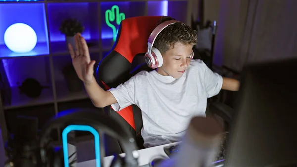 Adorable blond kid, a gaming streamer, dancing to music in gaming room, capturing hearts online! gaming and streaming at its cutest!