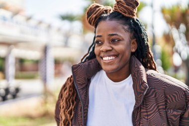 African american woman smiling confident looking to the side at street