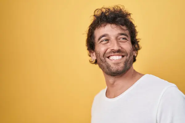 Young Hispanic Man Smiling Confident Looking Side Isolated Yellow Background — Stock Photo, Image