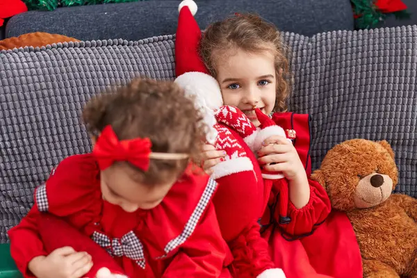 Adorable Girls Sitting Sofa Celebrating Christmas Home — Stock Photo, Image